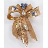 A 9ct gold sapphire and diamond brooch, in a bow and branch form, 7.9g.