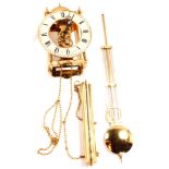 A Sewills of Liverpool brass cased skeleton lantern wall clock, circular dial with chapter ring bear