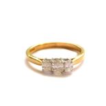 An 18ct gold and diamond three stone ring, set with oval cut diamonds, approx 0.4cts, size M, 2.9g.