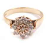 A 9ct gold and clear stone ring, in a flowerhead setting, size L/M, 2.4g.