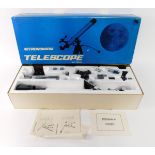 An Astronomical telescope with tripod, boxed.