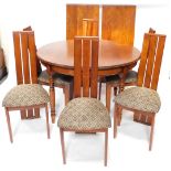 An oak dining room suite, comprising extending dining table, with moulded edge and turned legs, two