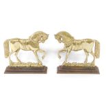 A pair of Victorian cast brass door stops or porters, in the form of profiled horse, on integral cas