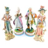 A pair of 19thC Continental bisque porcelain figures of a lady and gentleman, holding love birds, an
