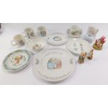 A group of Wedgwood Beatrix Potter table wares, to include plates, cups, and bowls, together with tw