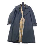 A Burberry gentleman's navy blue rain mac, polyester cotton cloth and lining.