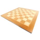 A wooden chess board, 48cm square.
