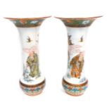 A pair of Japanese Kutani porcelain vases, with flared rim and enamelled and gilt diaper work border