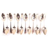 Twelve Dutch silver table spoons, monogram engraved, assay mark for The Hague, 22.10oz.