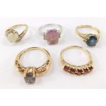 A collection of five 9ct gold dress rings, with multiple semi precious stones.