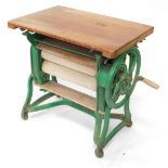 A Ewbank green painted cast iron mangle, with pine top, 76cm wide.