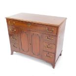 A Georgian mahogany side cabinet, with a three division long drawer, over a pair of cupboard doors,