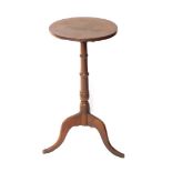 A 19thC oak wine table, the circular top on a turned column and tripod base, the top 36cm diameter.