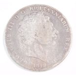 A George III silver crown 1819.