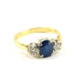 An 18ct gold sapphire and diamond three stone ring, size N, 3.3g.
