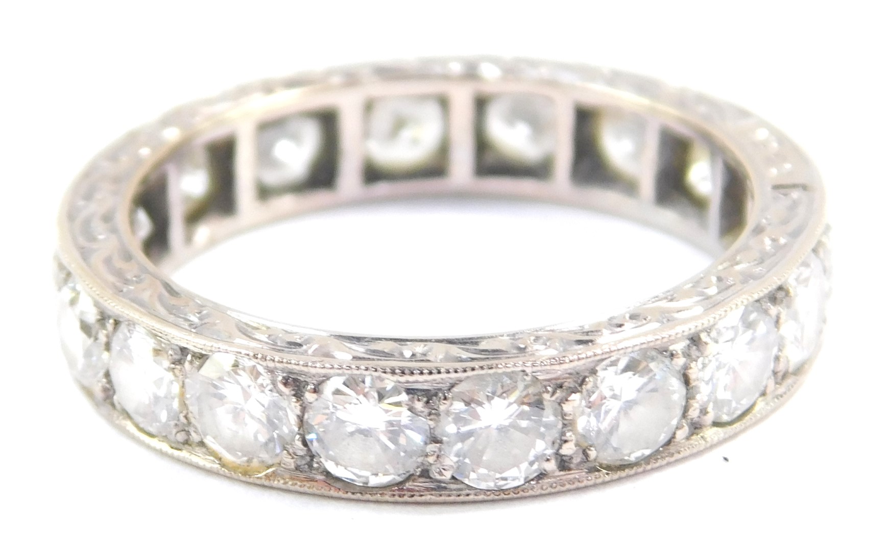 A diamond full eternity ring, set in white metal, stamped 18ct, approx 2.25cts, size P, 5.3g.