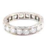 A diamond full eternity ring, set in white metal, stamped 18ct, approx 2.25cts, size P, 5.3g.