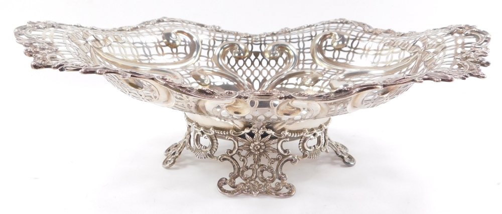 A Victorian silver centrepiece bowl, having elaborate scrolled and floriate rim, surrounding a multi - Bild 3 aus 4