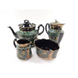A Jackfield Pottery late 19thC part tea set, gilded and enamelled with leaves against a green and bl