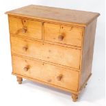 A Victorian pine chest of drawers, top with a moulded edge, above two short and two long drawers, ea