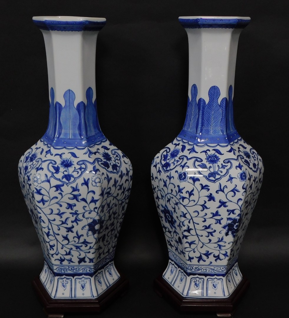 A pair of Chinese blue and white hexagonal baluster vases, decorated in a floral blue and white patt