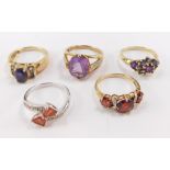 A collection of five 9ct gold dress rings, with multiple semi precious stones.