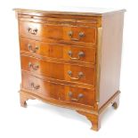 A mid 20thC yew serpentine bachelors chest, of four drawers, 77cm high, 70cm wide, 47cm deep.