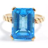 An emerald cut topaz ring, set in yellow metal, stamped 14ct and VAN CLEEF & ARPELS, size N, 5.8g.