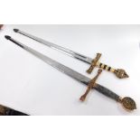Two replica swords, one stamped King Arthur Excalibur, each with a gilt metal pommel and handle, dec