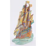 A Ditmar Urbach early 20thC pottery wall plaque, modeled as a three masted galleon, No 13956, printe