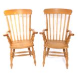 A pair of beech Windsor type lath back open armchairs, each with a solid seat, on turned legs and H