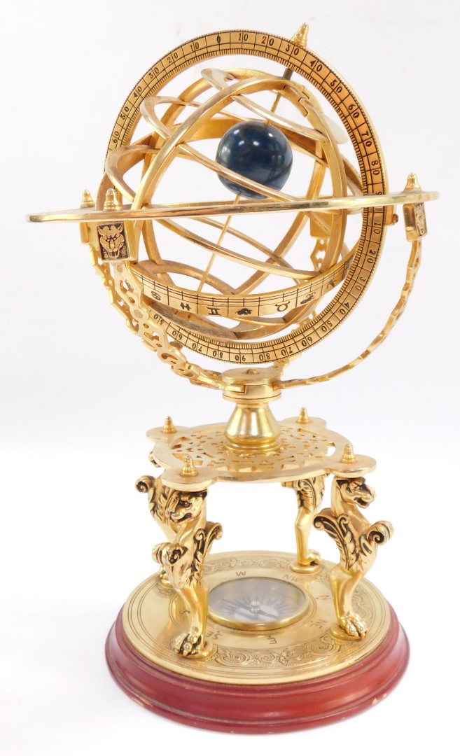 A brass orrery, with an astrological plate, raised on four supports above a table type base on three - Image 4 of 4