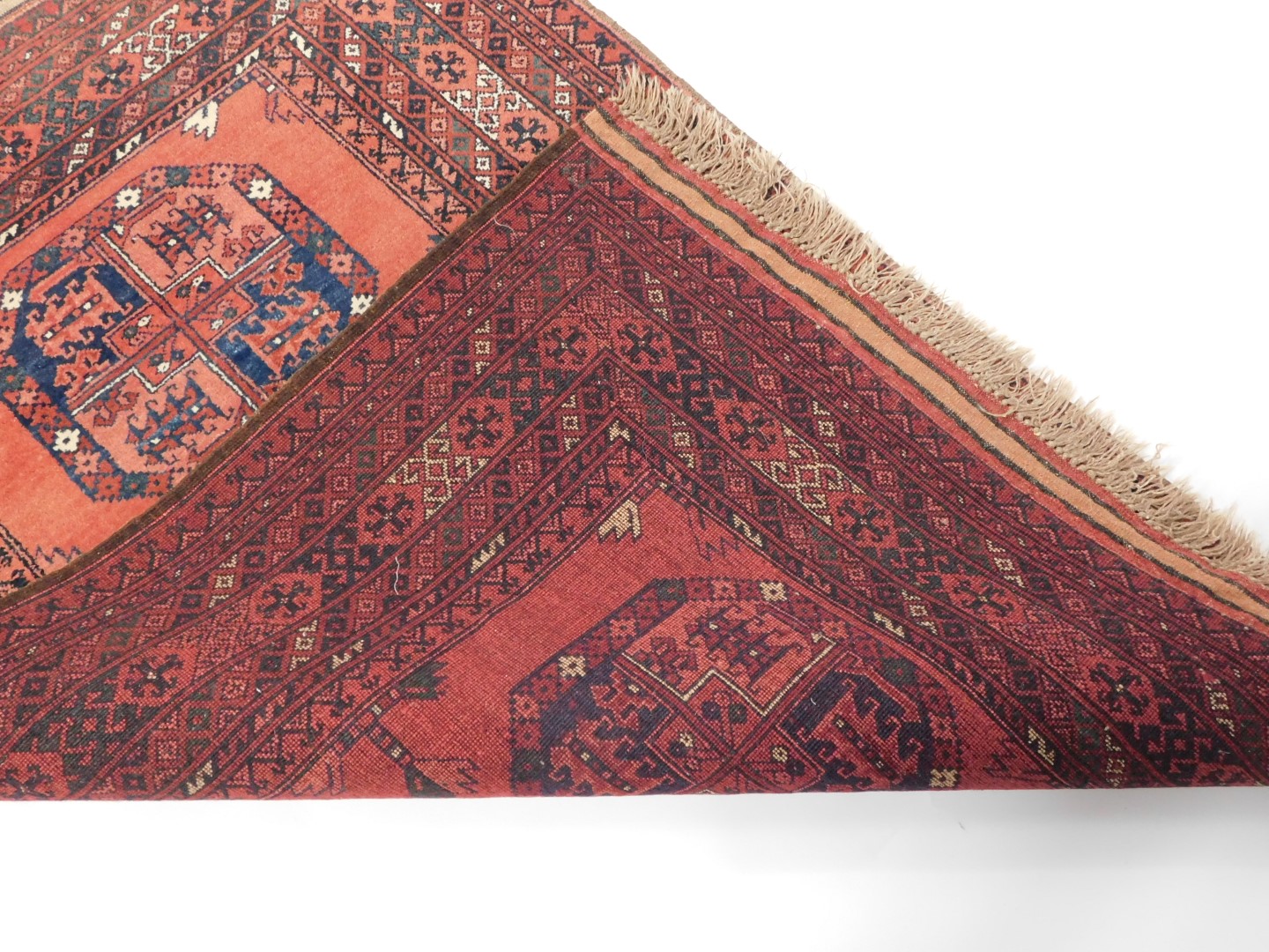 A Tekke rug, red ground decorated with three central guls, in repeating geometric borders, 153cm x 1 - Image 3 of 3