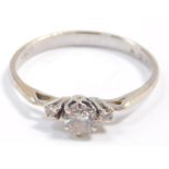 An 18ct gold and diamond three stone ring, 0.3ct, size M, 2.5g.