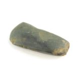 A Neolithic period polished axe head, purportedly found near Amesbury in Wiltshire, 11cm wide.