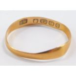A 22ct gold wedding band, size N, 1.0g.