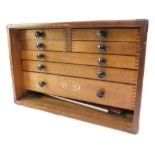 A Moore & Wright oak cased mechanical tool chest, containing micrometres, calipers and other precisi