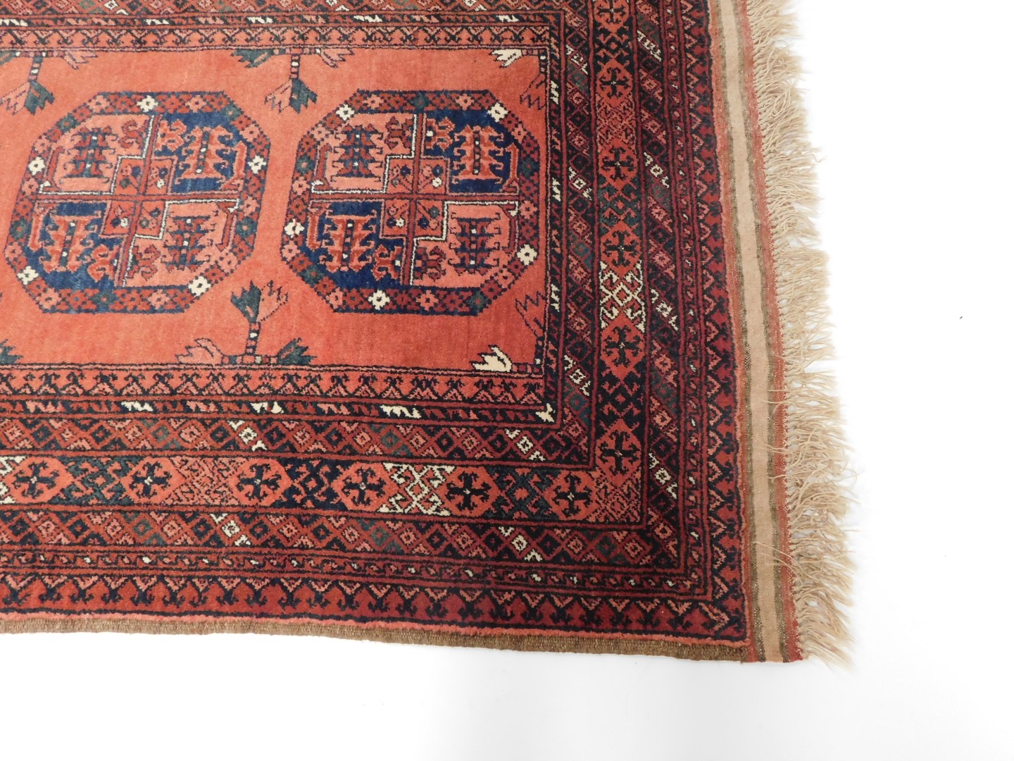 A Tekke rug, red ground decorated with three central guls, in repeating geometric borders, 153cm x 1 - Image 2 of 3