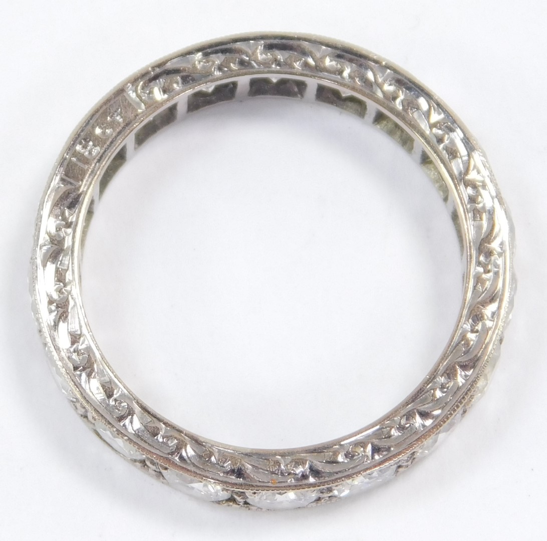 A diamond full eternity ring, set in white metal, stamped 18ct, approx 2.25cts, size P, 5.3g. - Image 2 of 3