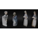 Four Lladro porcleian figures modlled girls, all standing, two holding piglets, 18cm high.