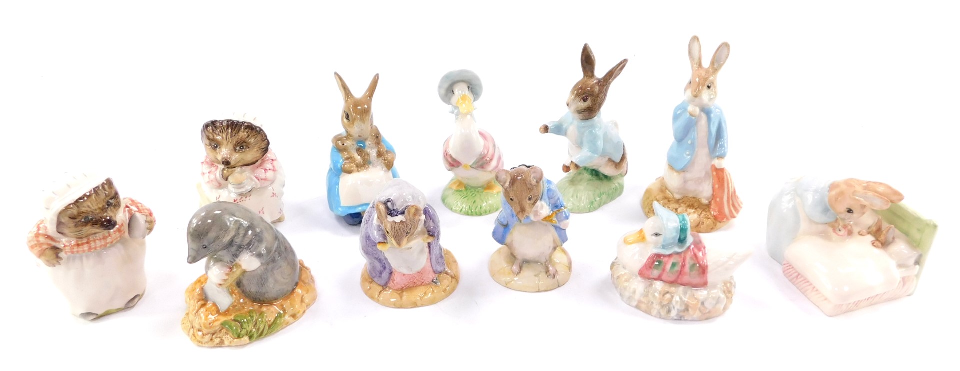 A selection of Beatrix Potter figures by Royal Albert, including Peter Rabbit, Mrs Rabbit and Bunnie