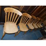 A set of six beech lath back kitchen chairs.