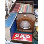 A 20thC oak cased mantel clock, books to include The World of Wonder, Oxo tin, brass dishes, etc. (a