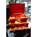 A jewellery box containing a quantity of costume jewellery, to include a Wedgwood Jasperware brooch,