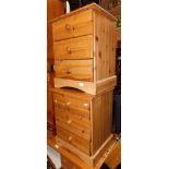 A pair of pine three drawer bedside chests.