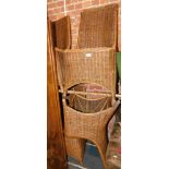 A set of four wicker dining chairs.