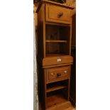 A pair of pine bedside cabinets.