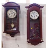 Two wall clocks.