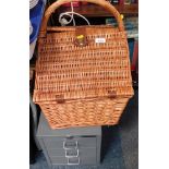A wicker picnic hamper, and a Bisley three drawer metal filling cabinet.