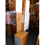 A late 20thC teak and white melamine bedroom suite, comprising wardrobe, bedside cabinets, dressing